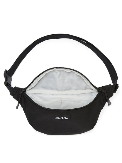 Ela Mo™ Hipbag | Schwarz, geöffnet – Innenbereich mit zwei kleinen Fächern.