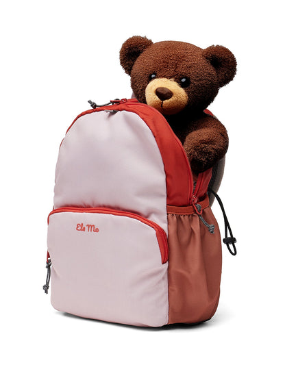 Ela Mo™ Kinderrucksack (3-6 Jahre) | Cotton Candy. Ein kleiner Teddybär schaut aus einem rosafarbenen Rucksack.